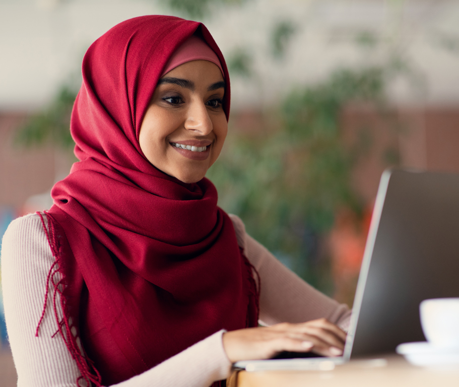 Afghan student using a laptop for online learning